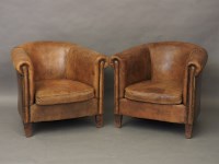 Lot 578 - A pair of leather tub chairs