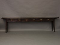 Lot 662 - An oak long dresser with three drawers
