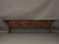 Lot 671 - A low dresser with an adzed top