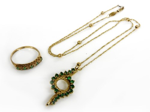 Lot 64 - A gold 's' link and bead necklace marked 375 with an emerald pendant