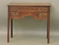 Lot 804 - A George III oak lowboy