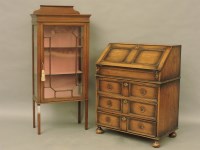 Lot 680 - An antique style oak bureau