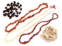 Lot 206 - A quantity of ivory and amber chip bead necklaces