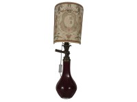 Lot 432 - A ruby glass lamp