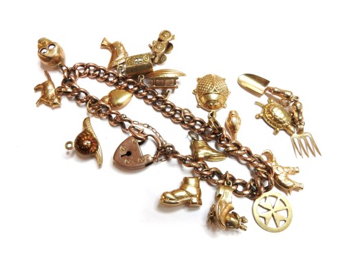 Lot 30 - A gold hollow curb link charm bracelet