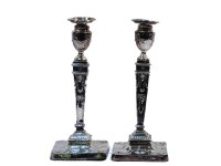Lot 143 - A pair of silver candlesticks