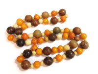 Lot 94 - A single row of uniformed circular amber beads