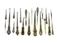 Lot 148 - 16 silver and mother of pearl handled button hooks