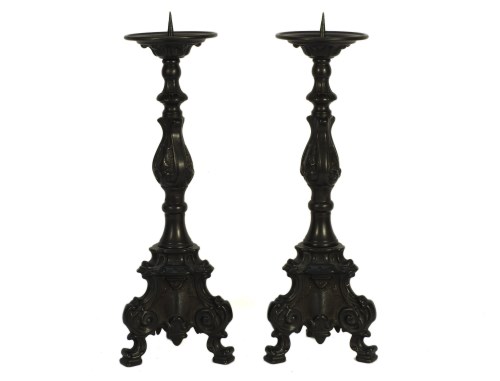 Lot 362 - A pair of cast pricket candlesticks