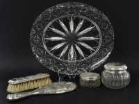 Lot 132 - A silver topped three piece dressing table set