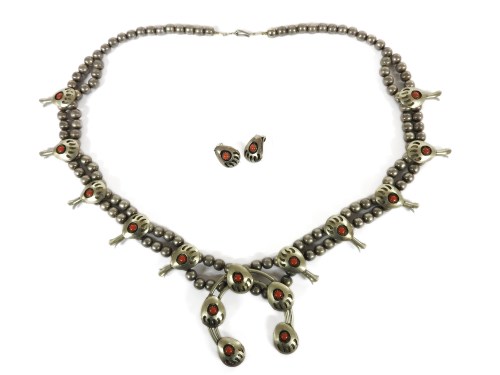 Lot 89 - A native American Navajo coral coloured cabochon set design squash blossom necklace