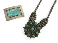 Lot 92 - A native American silver necklace with turquoise floral shaped centrepiece
