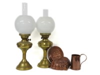 Lot 206 - A collection of oil lamps and copper wares