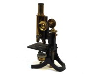 Lot 328 - A lacquered brass microscope