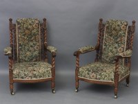 Lot 471 - A pair of Victorian carved oak arm chairs