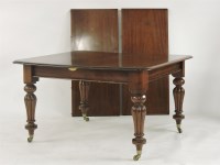 Lot 695 - A Victorian mahogany drawer leaf extending dining table on reeded baluster legs