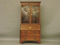 Lot 809 - An Edwardian classical revival inlaid bureau bookcase