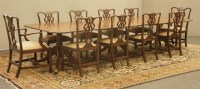 Lot 548 - A large George III-style mahogany triple-pillar dining table