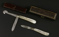 Lot 49 - An early 20th century silver and mother-of-pearl handled folding fruit knife and orange peeler