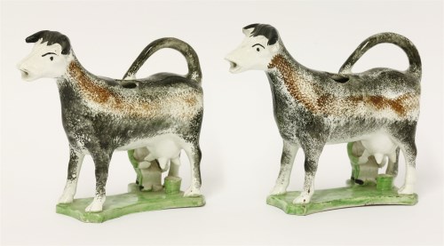 Lot 1 - Two cow creamers