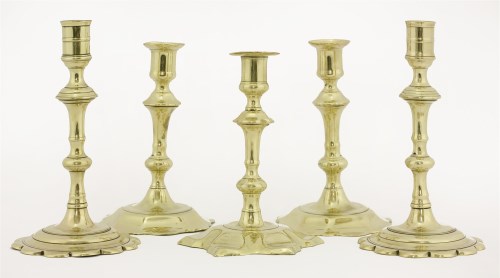 Lot 129 - Two pairs of brass candlesticks