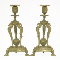 Lot 140 - A pair of Regency cast candlesticks