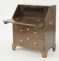 Lot 506 - A George II walnut bureau