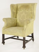 Lot 513 - A George III-style wing armchair