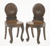 Lot 543 - A pair of mahogany hall chairs