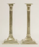 Lot 133 - A pair of paktong candlesticks