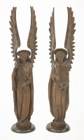 Lot 566 - A pair of carved oak altar angels