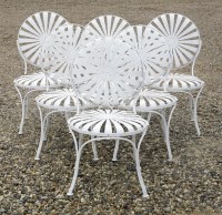 Lot 604 - A set of six white painted strapwork garden chairs