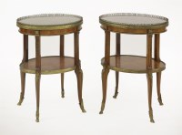 Lot 536 - A pair of French crossbanded kingwood oval tables