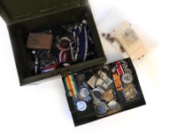 Lot 135 - A tin box of medals