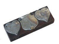 Lot 105 - Three small silver plaques mounted on a wooden block relating to the cricketing career of Mr W Bracey