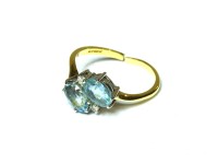Lot 5 - An 18ct aquamarine and diamond crossover ring