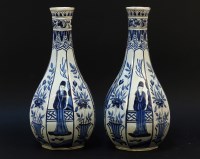 Lot 408 - A pair of Dutch delft bottle vases of octagonal faceted form