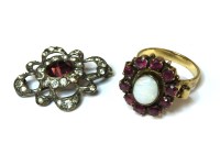 Lot 21 - An opal and ruby cluster ring