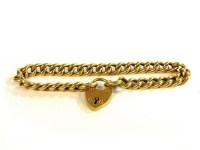 Lot 4 - A hollow curb link chain bracelet with a padlock clasp