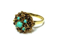 Lot 32 - A 9ct gold stained howlite cabochon and garnet cluster ring