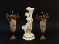 Lot 173 - A pair of late 19th century Continental porcelain urns and covers