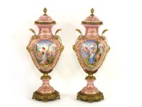 Lot 407 - A pair of Sevres urns and covers