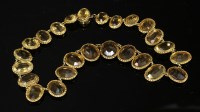 Lot 72 - A late Victorian gold and citrine graduated riviere necklace