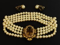 Lot 48 - A four row simulated pearl necklace