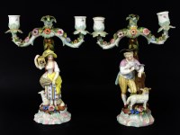 Lot 397 - A pair of Continental porcelain double candelabra