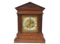 Lot 364 - An oak cased mantle clock