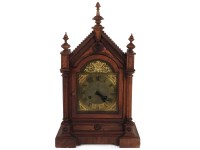 Lot 433 - A walnut carved architectural mantel clock