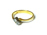 Lot 16 - An 18ct gold two stone diamond crossover ring