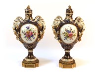 Lot 429 - A pair of early 20th century Serves design porcelain twin handled vases and covers