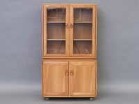 Lot 1720 - A quality elm Ercol bookcase